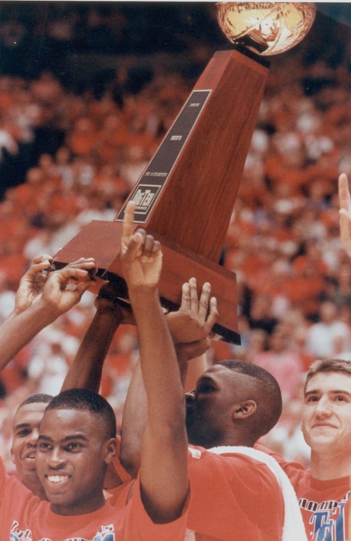 Indiana seniors Greg Graham, Chris Reynolds, Calbert Cheaney and Matt Nover raise the Big 10 trophy March 11, 1993.